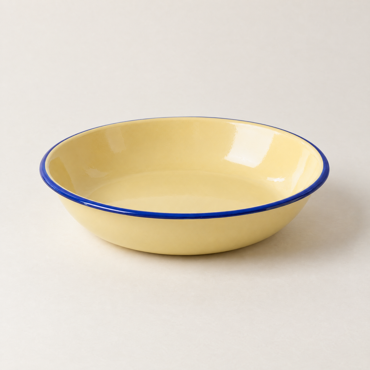 Aldorven 22 cm enamelled steel pasta bowl, butter yellow with a cobalt rim